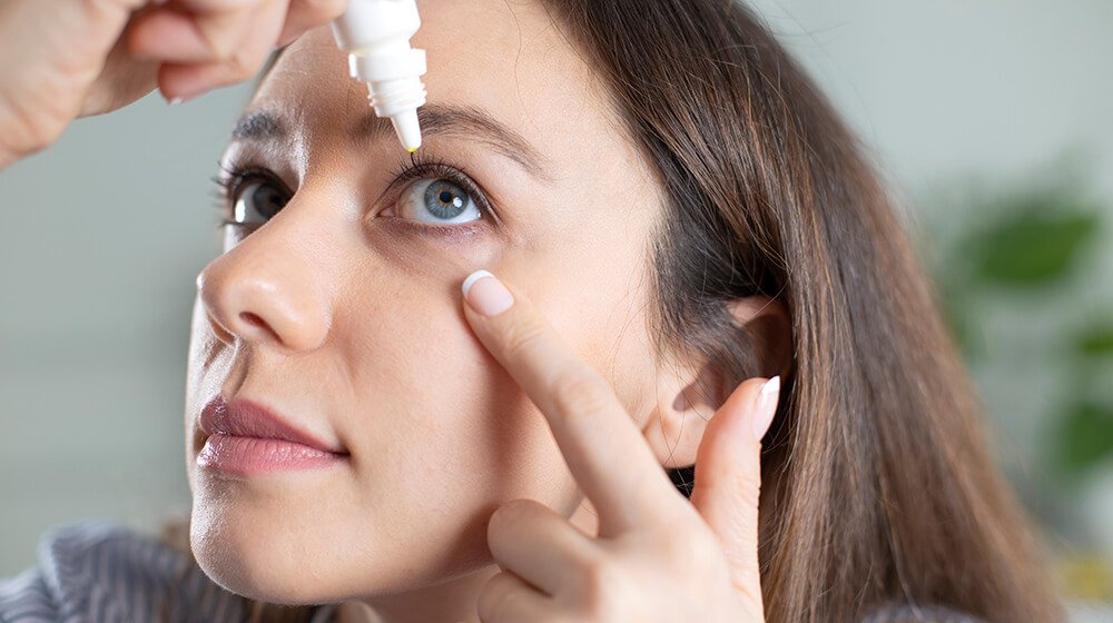 young woman uses eye drops How To Use Eye Drops