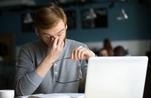 man-rubbing-his-eyes-What-Is-Digital-Eye-Strain-ss-feat