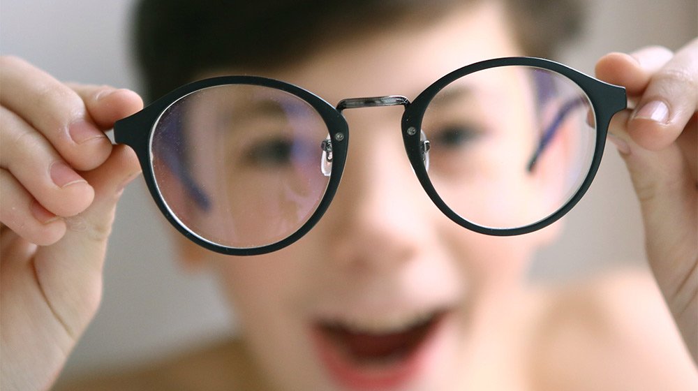 teenager-kid-boy-in-myopia-correction-glasses-close-up-portrait---How-Can-Poor-Vision-Affect-Children-In-Learning---ss-feat