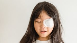 Lazy-Eye-amblyopia-in-children.Eye-care.Little-asian-girl-covered-up-with-a-special-patch-online-learning-at-home---What-is-Amblyopia-(Lazy-Eye)-and-How-to-Prevent-It---ss-feat